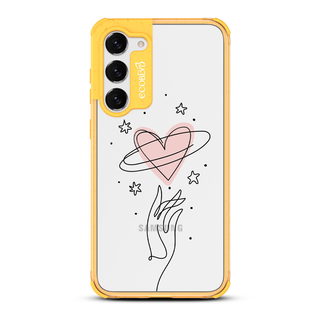 Be Still My Heart - Yellow Eco-Friendly Galaxy S23 Plus Case with Hand Reaching For Pink Heart On A Clear Back