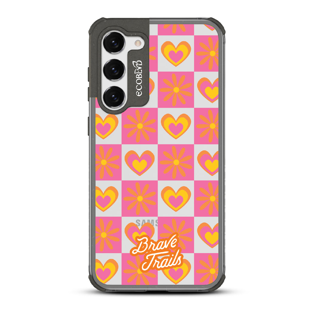 Free Spirit X Brave Trails - Black Eco-Friendly Galaxy S23 Case with Pink Checkered Hearts & Flowers On Clear Back