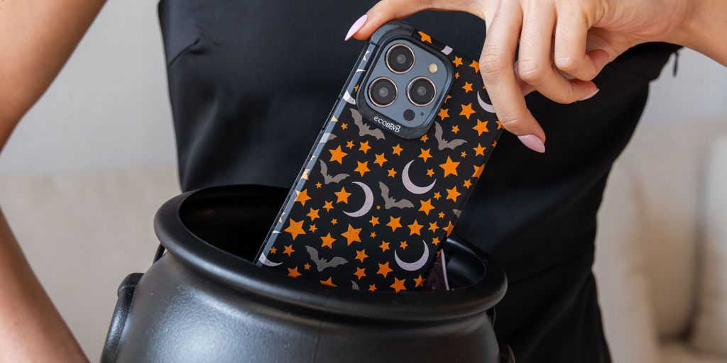 Woman putting iPhone With EcoBlvd's Stellar Nightwing phone case on into Cauldron