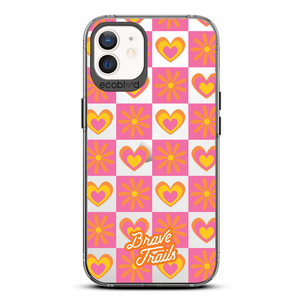 Free Spirit X Brave Trails - Black Eco-Friendly iPhone 12/12 Pro Case with Pink Checkered Hearts & Flowers On Clear Back