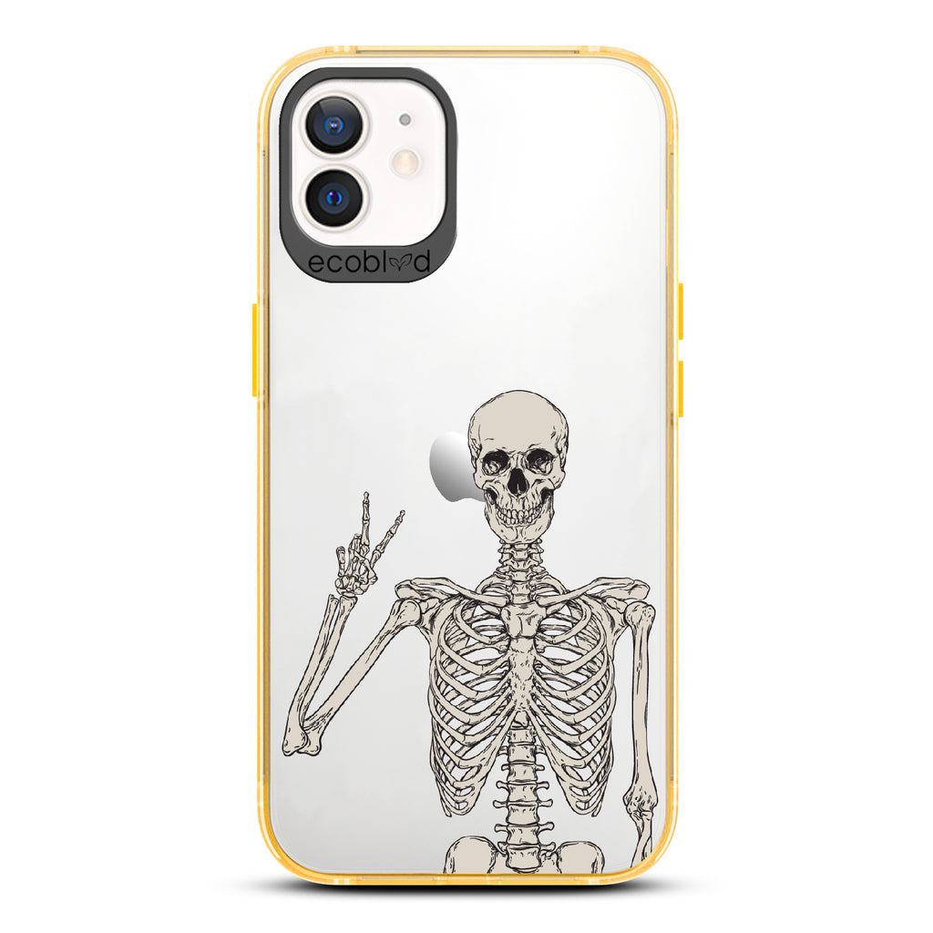 Creepin' It Real - Yellow Eco-Friendly iPhone 12/12 Pro Case With Skeleton Giving A Peace Sign On A Clear Back