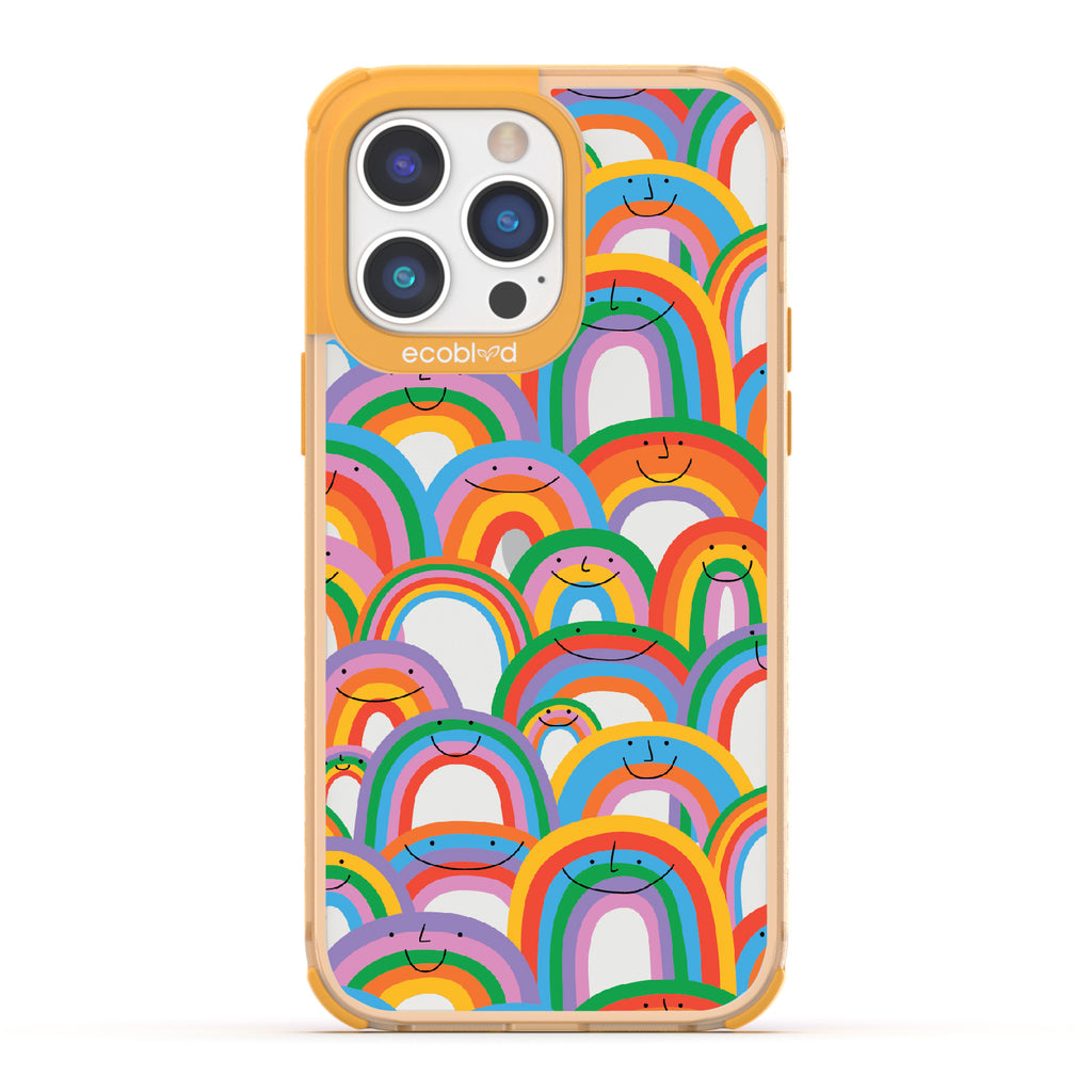 Prideful Smiles - Yellow Eco-Friendly iPhone 14 Pro Max Case With Rainbows That Have Smiley Faces On A Clear Back