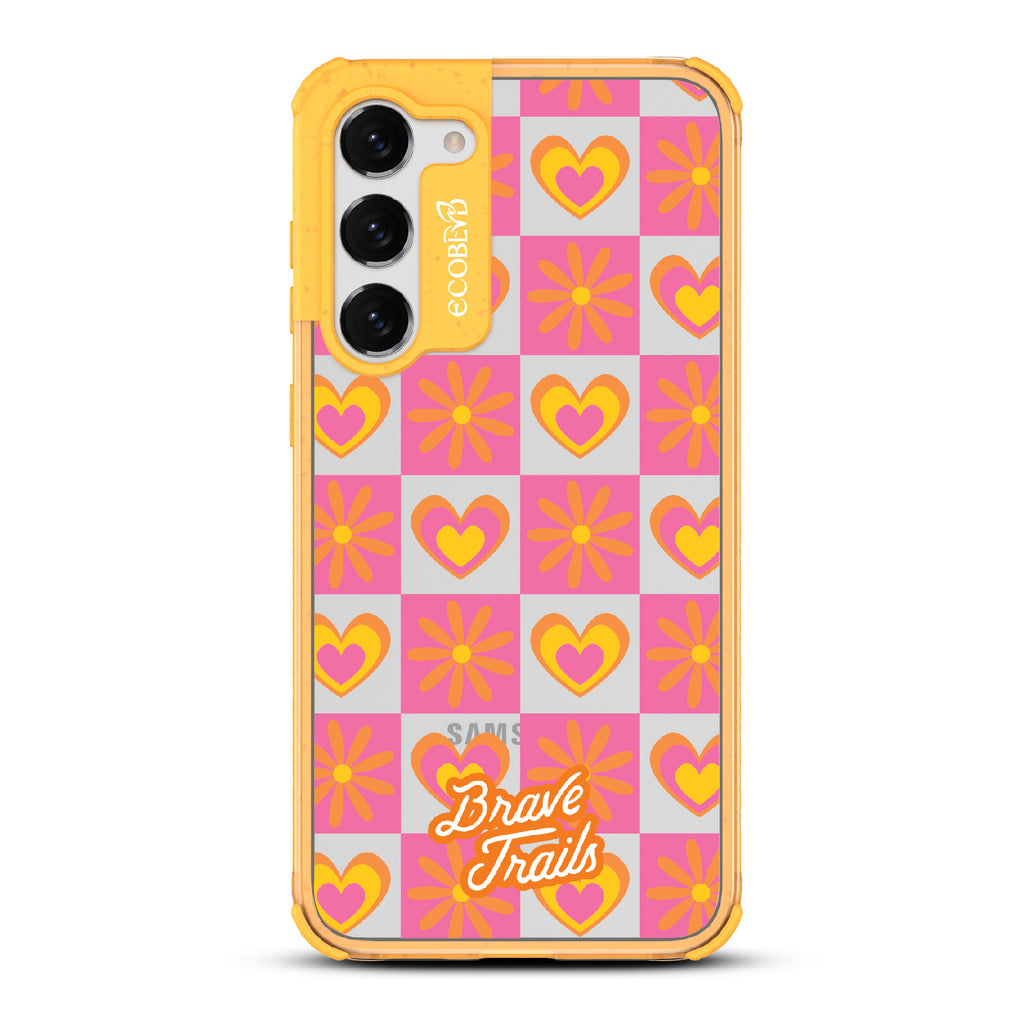 Free Spirit X Brave Trails - Yellow Eco-Friendly Galaxy S23 Plus Case with Pink Checkered Hearts & Flowers On Clear Back