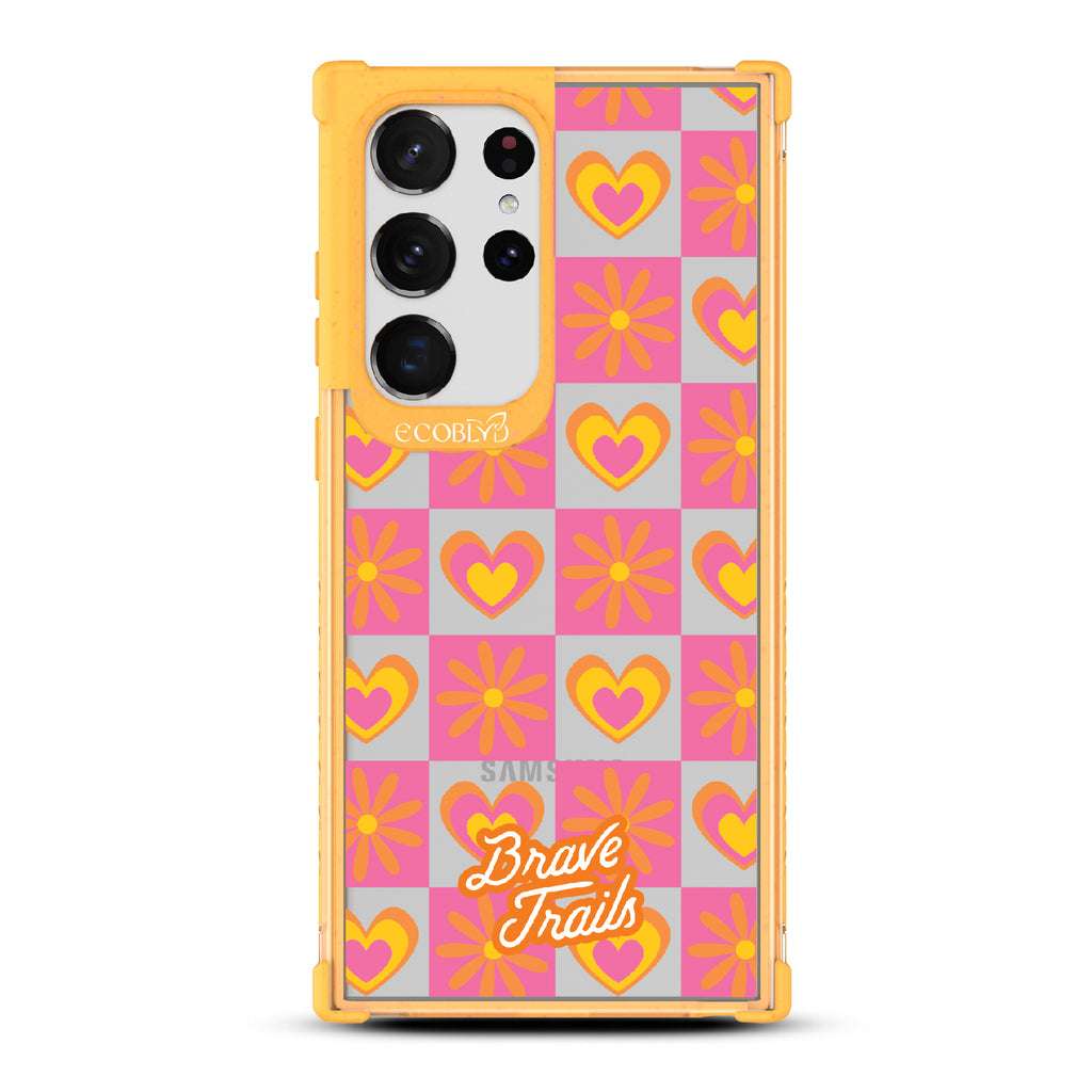 Free Spirit X Brave Trails - Yellow Eco-Friendly Galaxy S23 Ultra Case with Pink Checkered Hearts & Flowers On Clear Back
