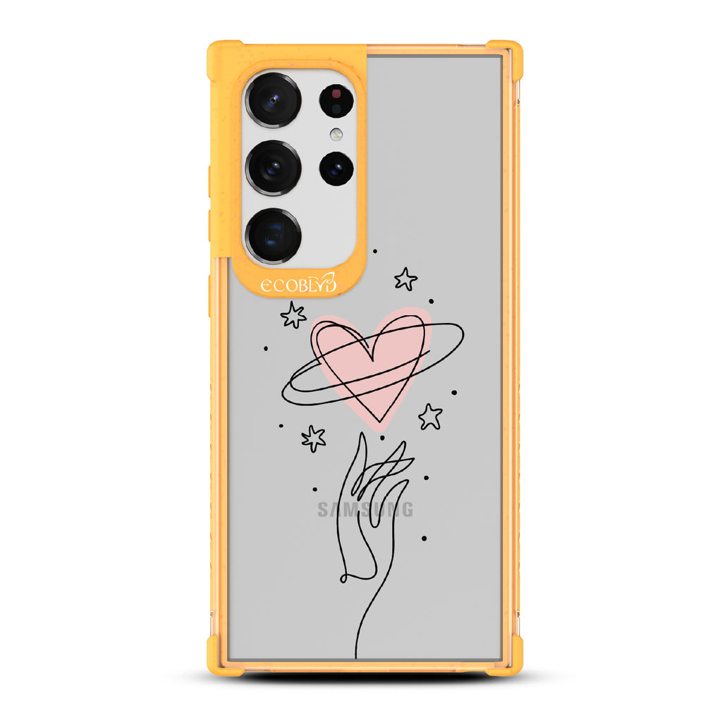 Be Still My Heart - Yellow Eco-Friendly Galaxy S23 Ultra Case with Hand Reaching For Pink Heart On A Clear Back