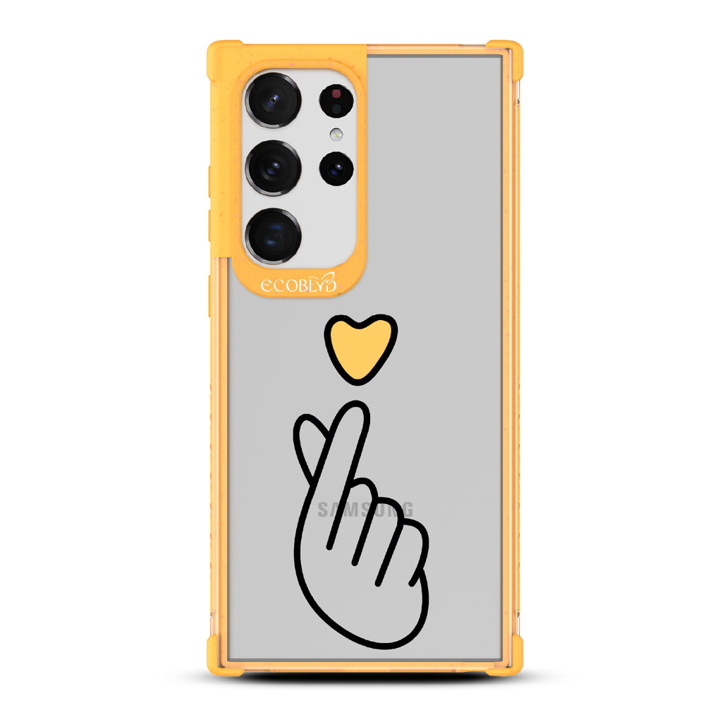 Finger Heart - Yellow Eco-Friendly Galaxy S23 Ultra Case With Yellow Heart Above Finger Heart Gesture On A Clear Back