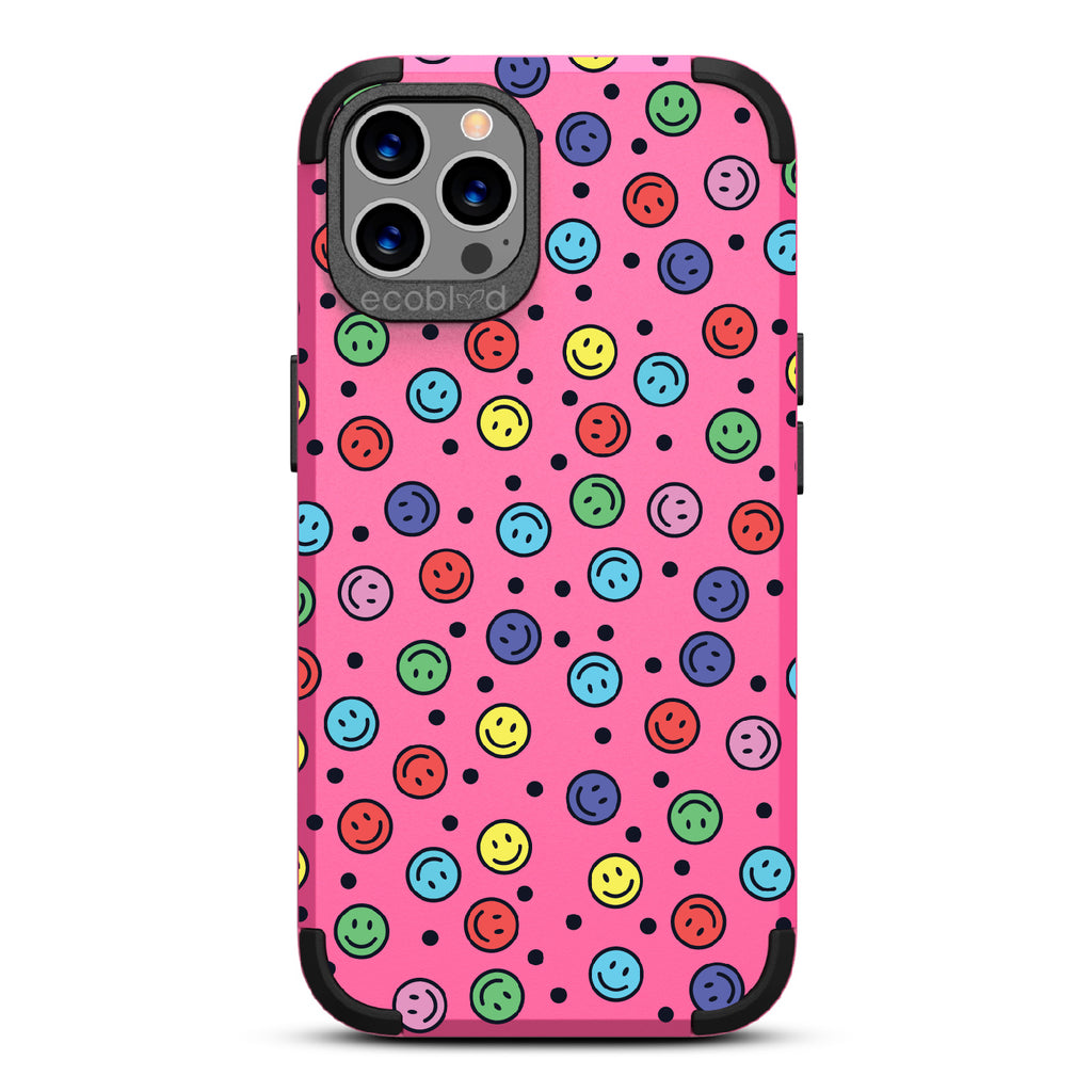 All Smiles - Pink Rugged Eco-Friendly iPhone 12/12 Pro Case With Multicolored Smiley Faces & Black Dots On Back