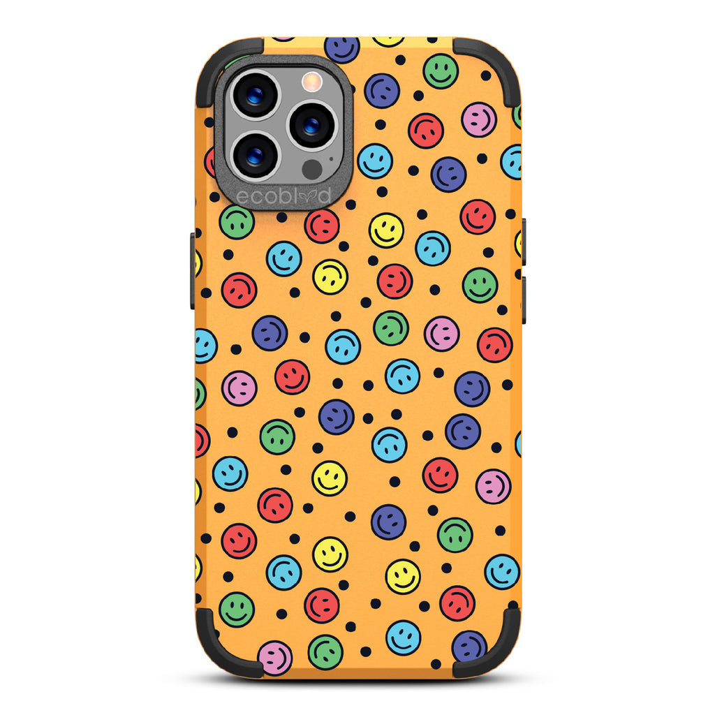 All Smiles - Yellow Rugged Eco-Friendly iPhone 12/12 Pro Case With Multicolored Smiley Faces & Black Dots On Back