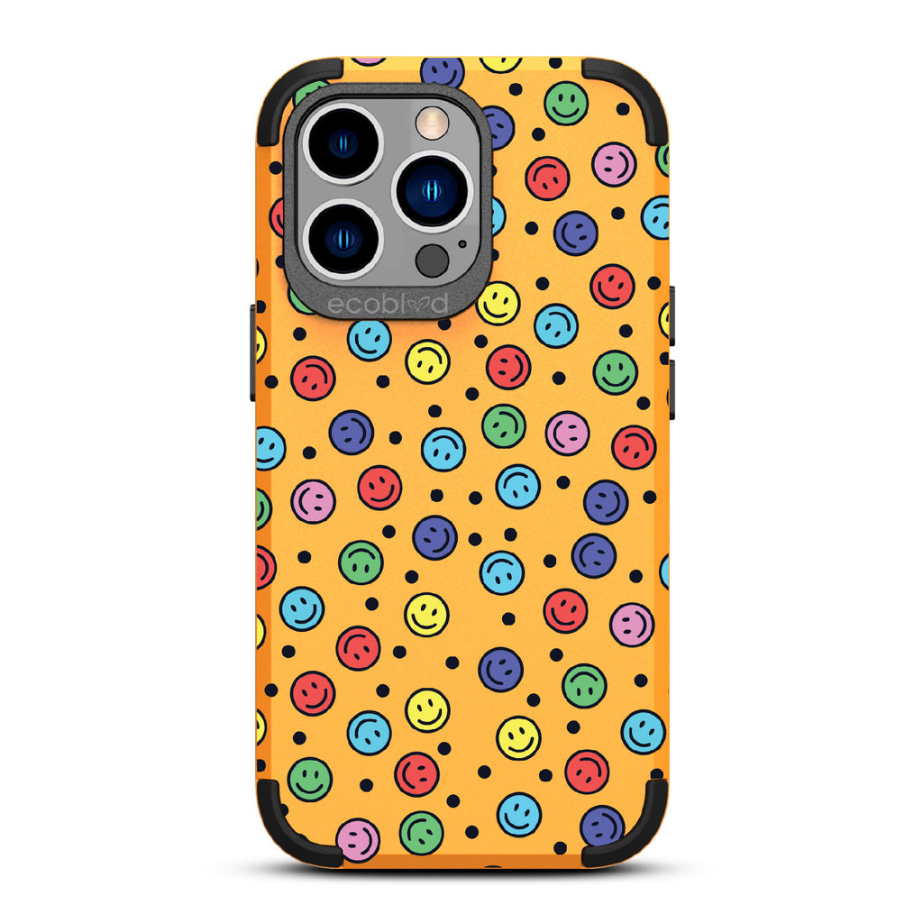 All Smiles - Yellow Rugged Eco-Friendly iPhone 12/13 Pro Max Case With Multicolored Smiley Faces & Black Dots On Back