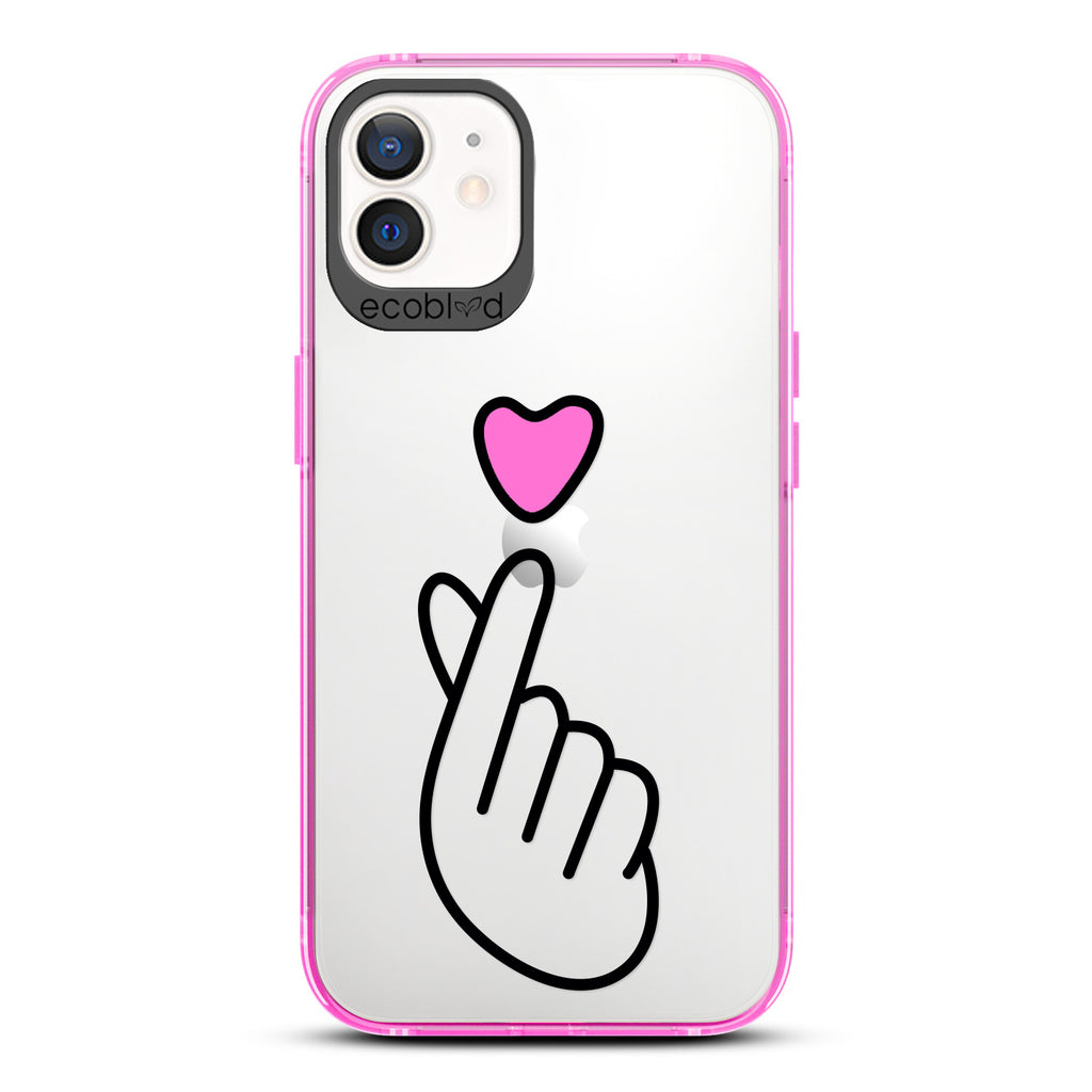 Love Collection - Pink iPhone 12 / 12 Pro Case - Pink Heart Above Hand With Index Finger & Thumb Crossed On Clear Back