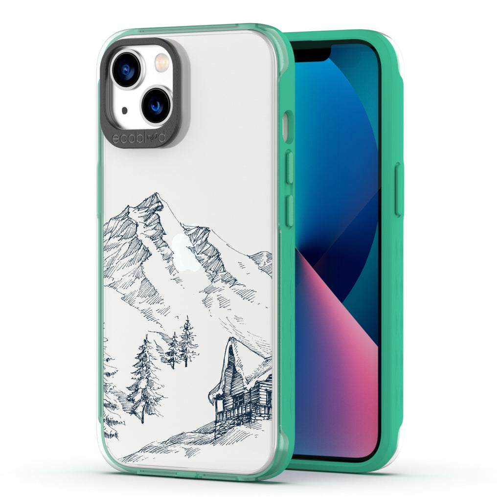 Winter Collection - Green Compostable iPhone 13 Case - Snowy Mountainside Wood Cabin On A Clear Back