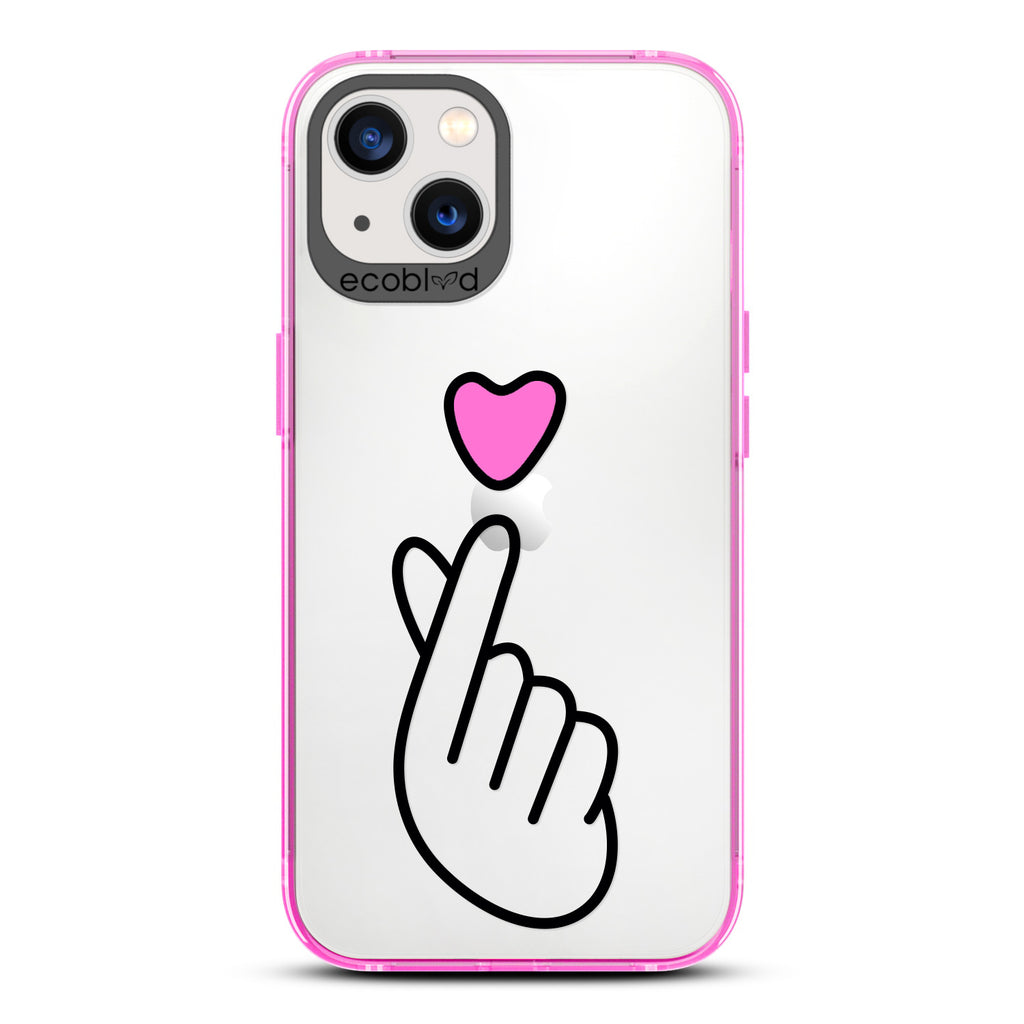 Love Collection - Pink iPhone 12 / 12 Pro Case - Pink Heart Above Hand With Index Finger & Thumb Crossed On A Clear Back