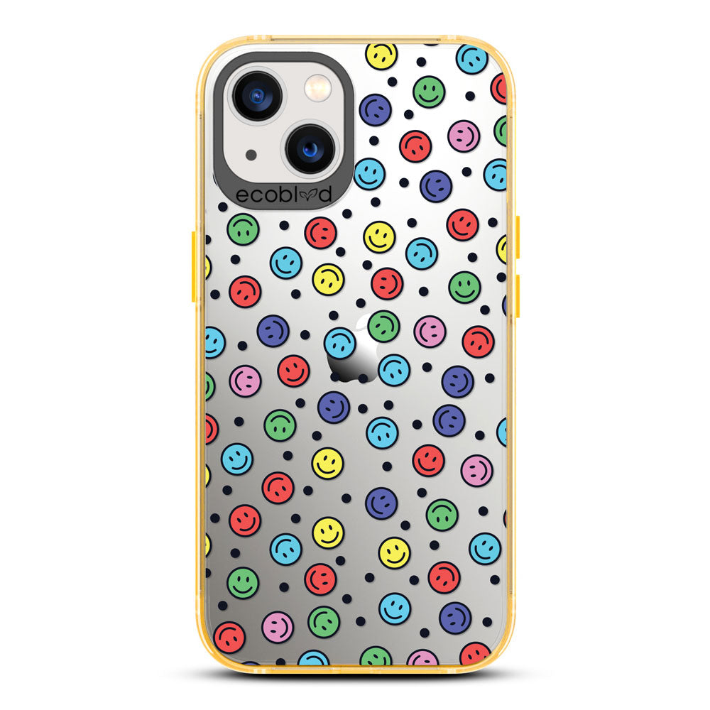 Laguna Collection - Yellow Eco-Friendly iPhone 13 Case With Multicolored Smiley Faces & Black Dots On A Clear Back 