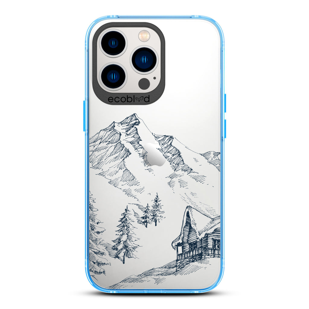 Winter Collection - Blue Compostable iPhone 12 & 13 Pro Max Case - Snowy Mountainside Wood Cabin On A Clear Back