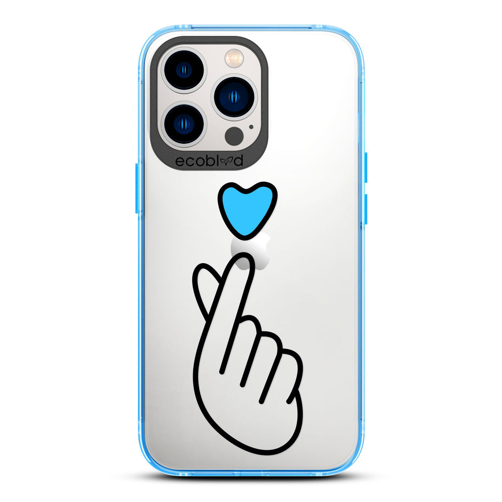 Love Collection - Blue iPhone 12 & 13 Pro Max Case - Blue Heart Above Hand With Index Finger & Thumb Crossed On Clear Back