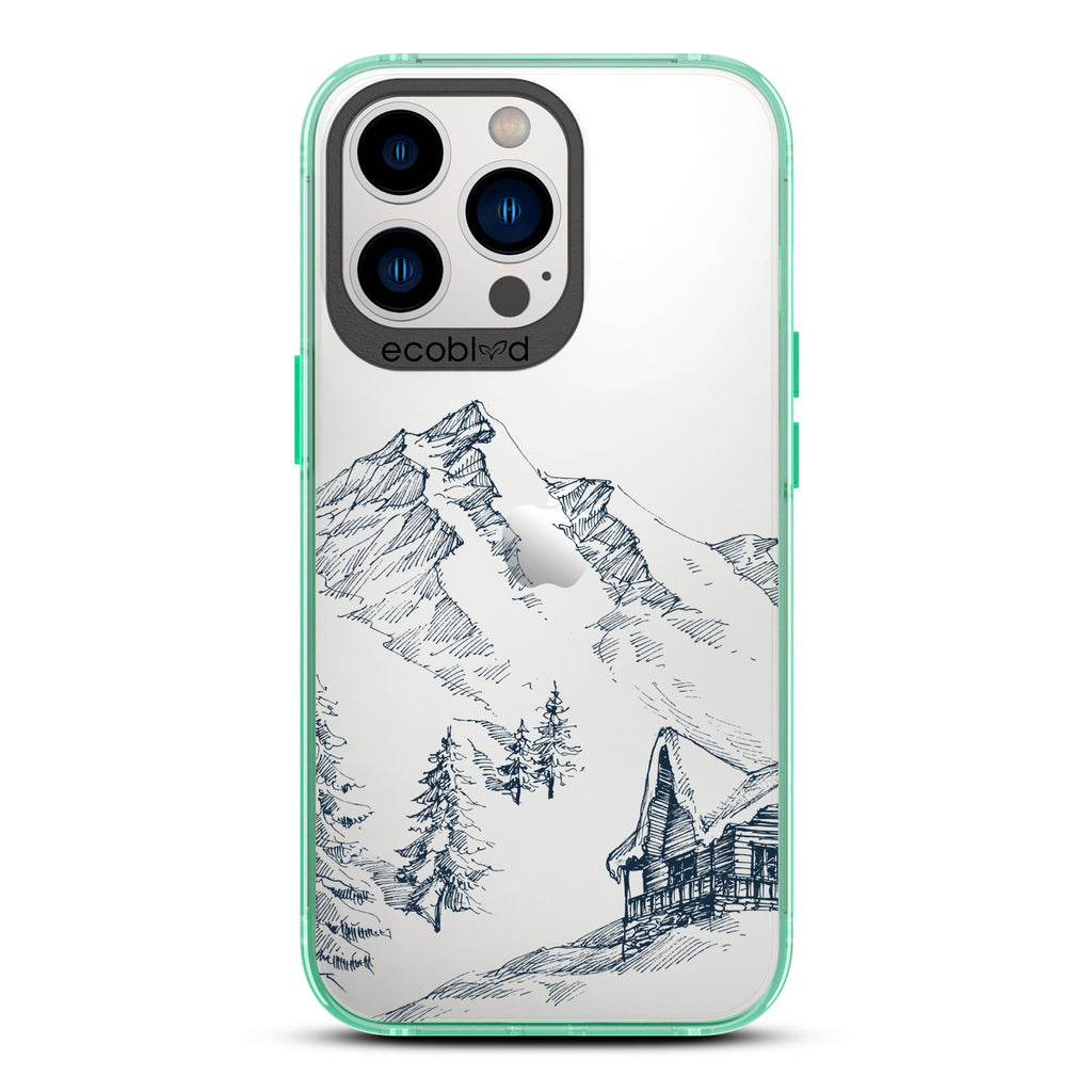 Winter Collection - Green Compostable iPhone 13 Pro Case - Snowy Mountainside Wood Cabin On A Clear Back