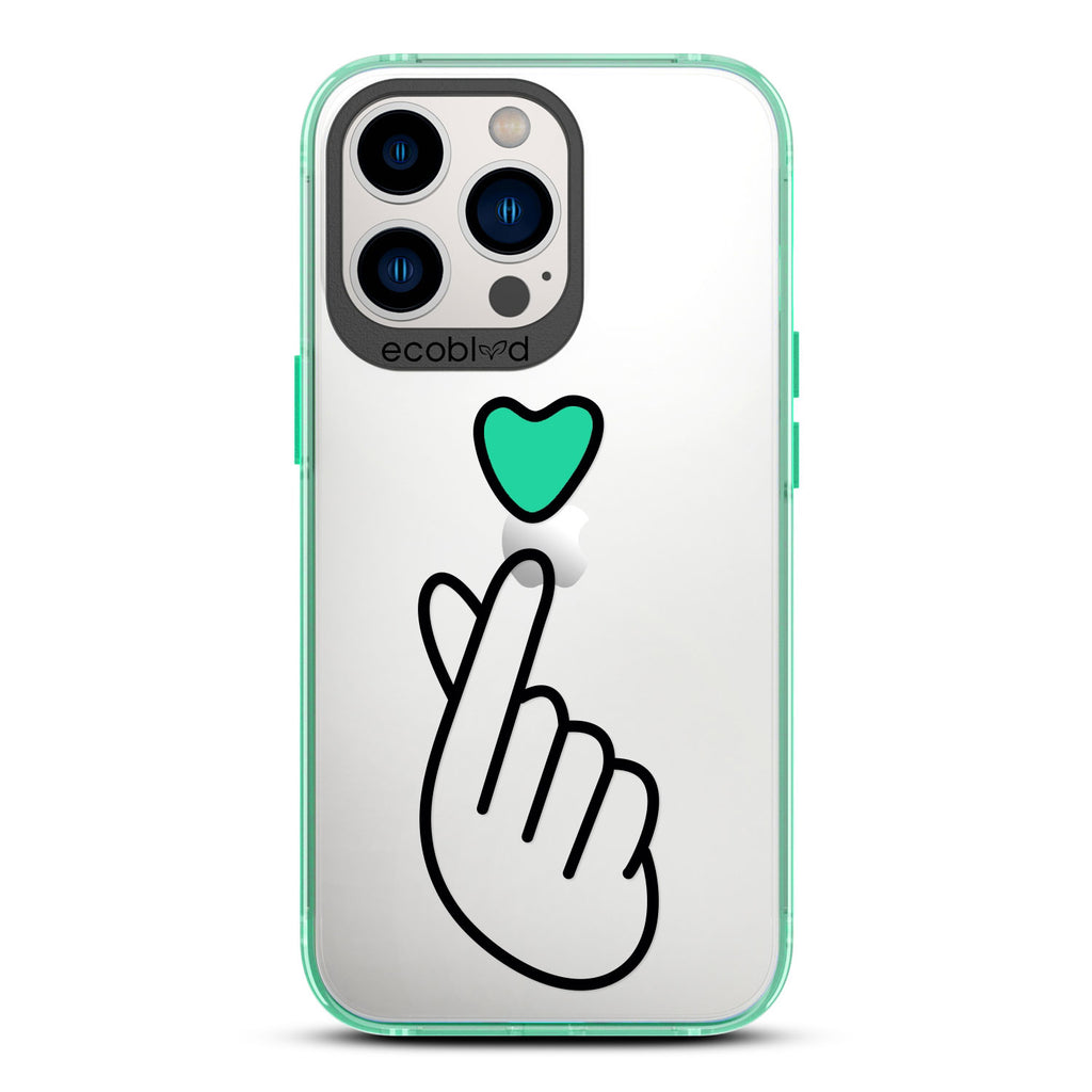 Love Collection - Green iPhone 12 & 13 Pro Max Case - Green Heart Above Hand With Index Finger & Thumb Crossed On Clear Back