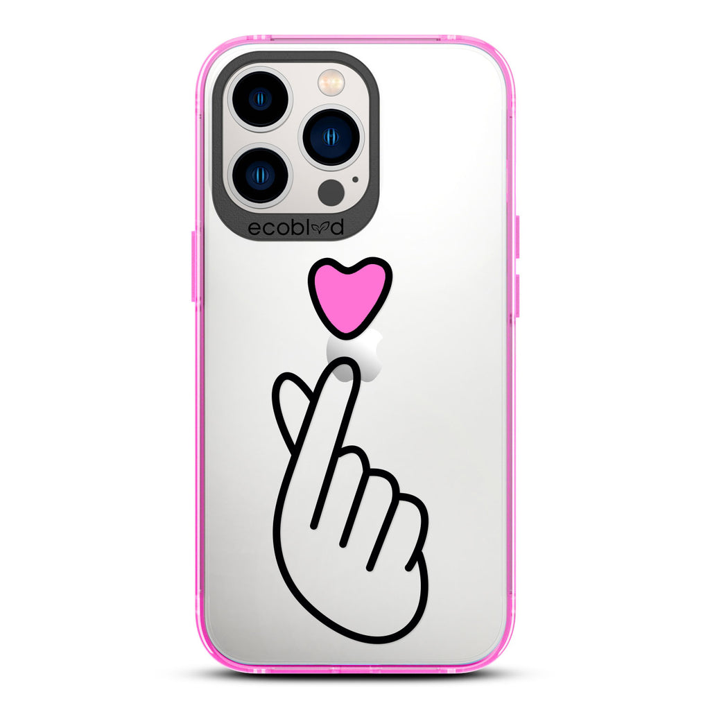 Love Collection - Pink iPhone 12 & 13 Pro Max Case - Pink Heart Above Hand With Index Finger & Thumb Crossed On Clear Back