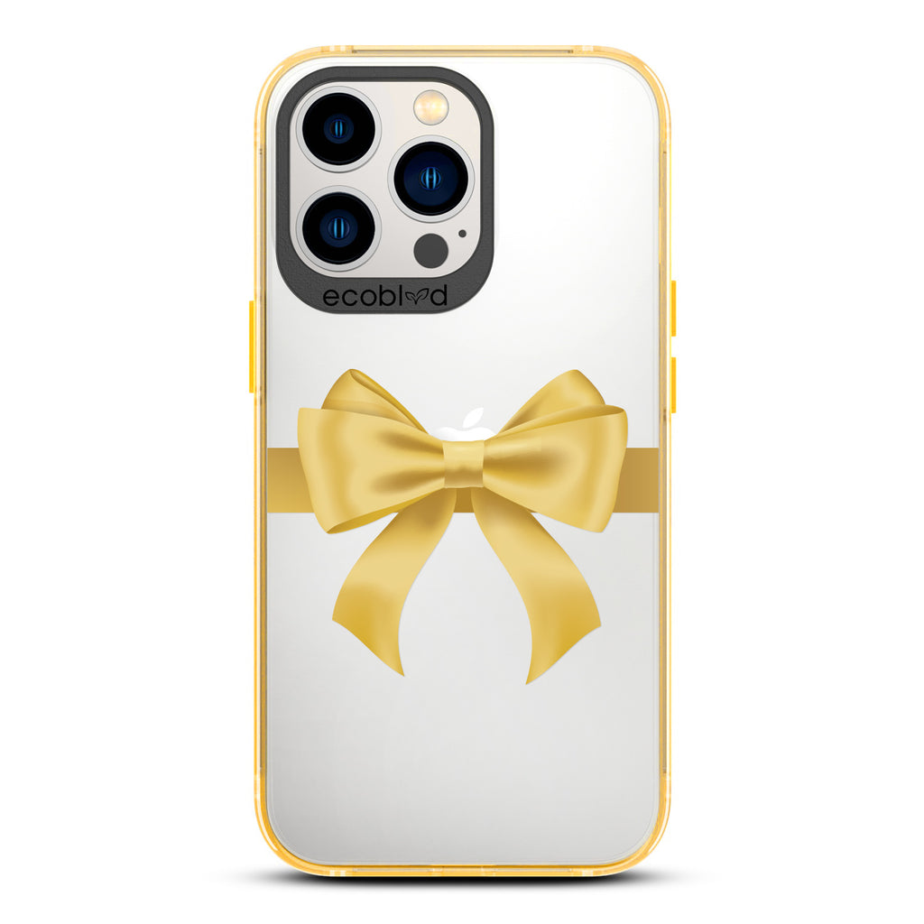 Winter Collection - Yellow Eco-Friendly Laguna iPhone 12 & 13 Pro Max Case With A Yellow Gift Bow Printed On A Clear Back