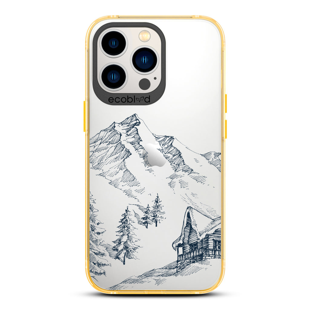 Winter Collection - Yellow Compostable iPhone 13 Pro Case - Snowy Mountainside Wood Cabin On A Clear Back