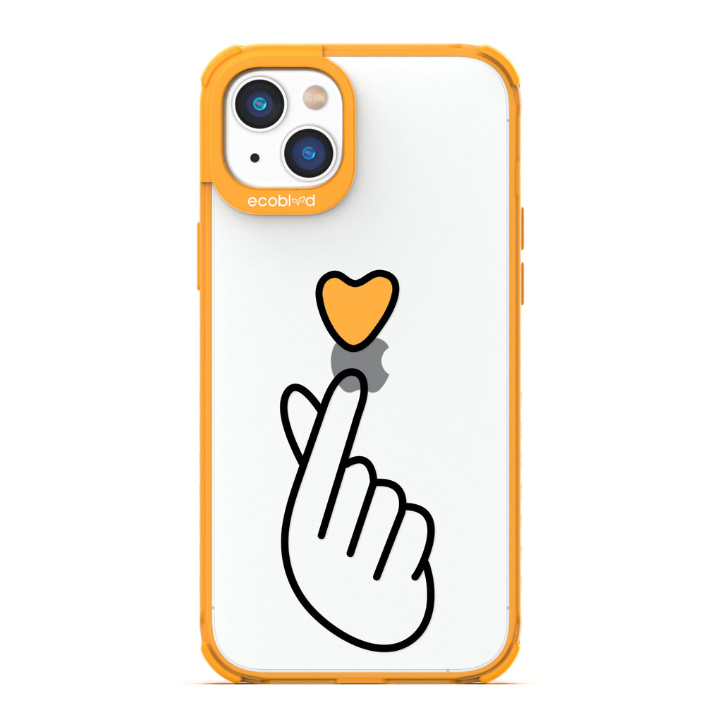 Love Collection - Yellow iPhone 14 Plus Case - Yellow Heart Above Hand With Index Finger & Thumb Crossed On Clear Back