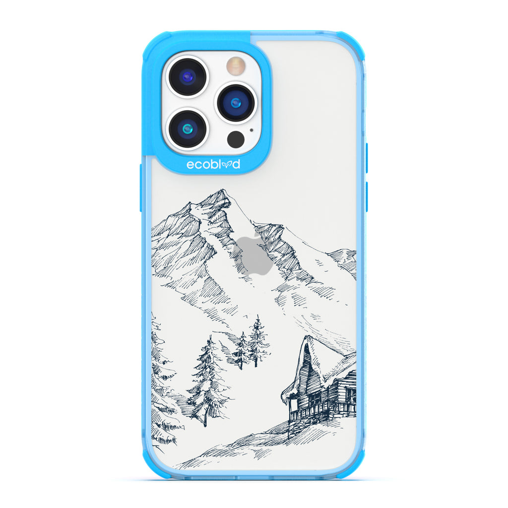 Winter Collection - Blue Compostable iPhone 14 Pro Case - Snowy Mountainside Wood Cabin On A Clear Back