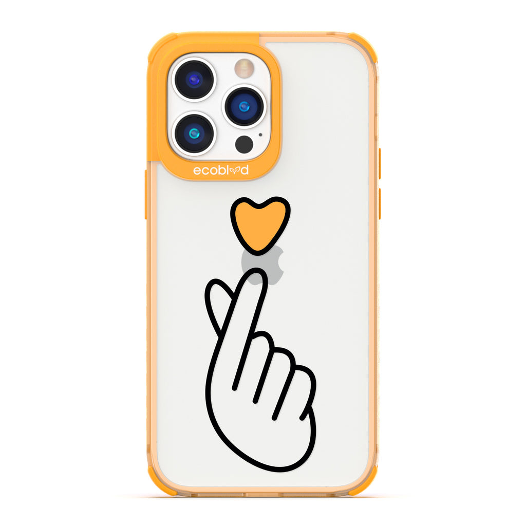 Love Collection - Yellow iPhone 14 Pro Case - Yellow Heart Above Hand With Index Finger & Thumb Crossed On Clear Back