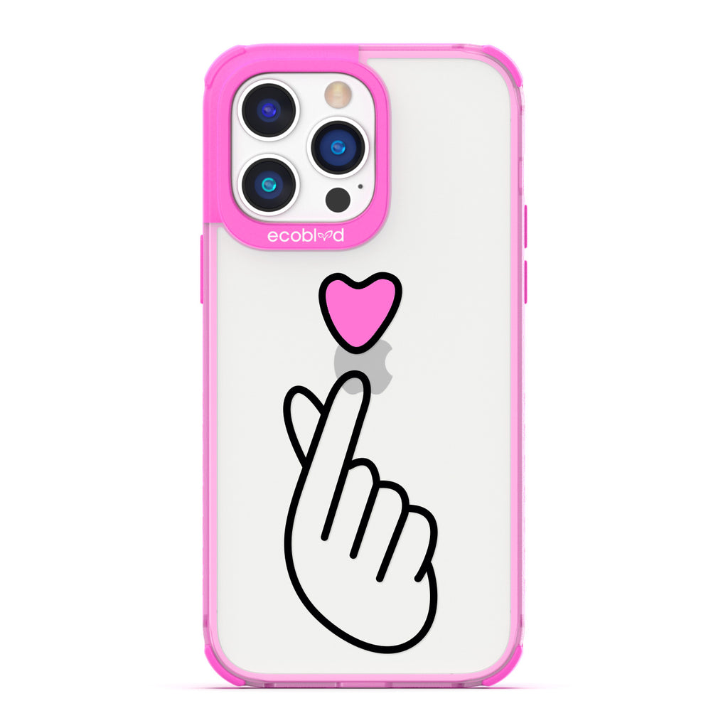 Love Collection - Pink iPhone 14 Pro Max Case - Pink Heart Above Hand With Index Finger & Thumb Crossed On Clear Back