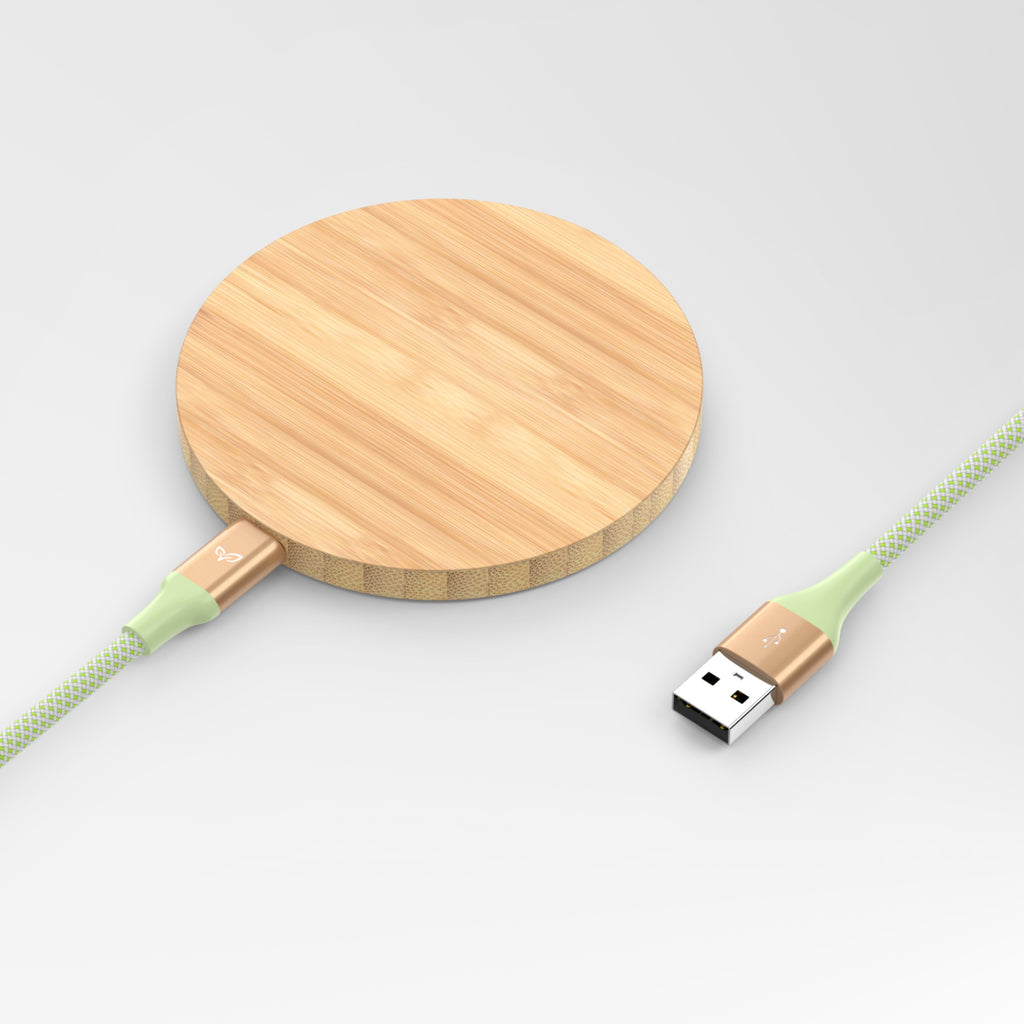 USB-A to USB-C Power Cable Plugged Into An Eco-Friendly Bamboo Wireless Charger  